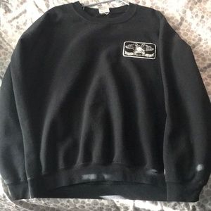 Black pullover with print on back
